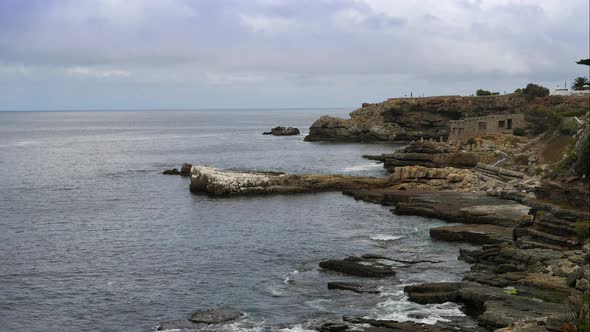 TimeLapse - Small waves crashing into very rocky coastline of historic Hermanus, South Africa.