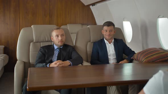Luxury Life of Businesspeople Discussing Inside Business Private Jet