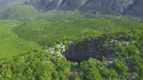 4k drone aerial footage over Neraidokipos Fairy garden hole near Kalamata Peloponnese peloponissos G