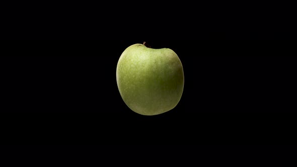 Half Appetizing Green Tasty Apple Spin or Rotate on Black Background. Healthy Eating Concept To Keep
