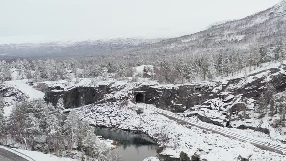 Snowy Train Tracks In The Countryside Of Dovre, Innlandet County, Norway - aerial drone shot