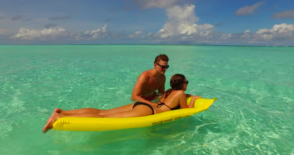 Beautiful people on honeymoon vacation have fun on beach on paradise white sand background 4K