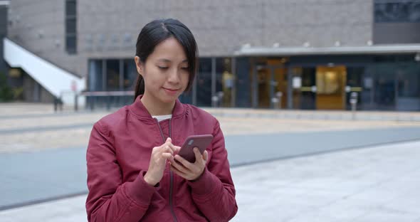 Woman use mobile phone at outdoor