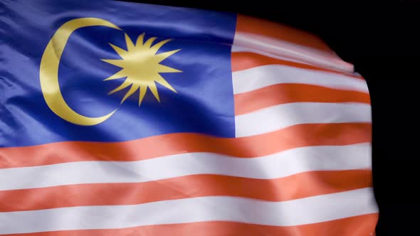 National Flag of Malaysia. Black background.