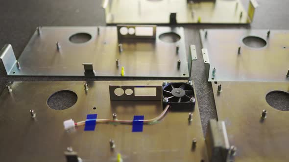 Slider Shot of a Blank Metal Components in Workshop Laboratory