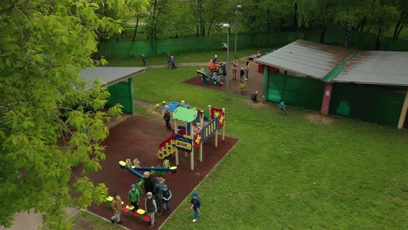 Children Play on the Playground in Kindergarten in Summer Aerial View