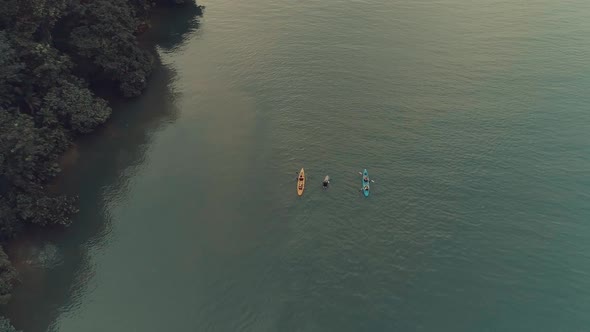 Drone footage during sunset from an elegant boat anchored at big river