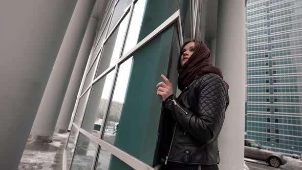 Female City Dweller is Posing Near Modern Building in Business District of Town