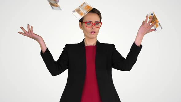 Business Woman in Glasses Tossing Money in the Air on Gradient Background.