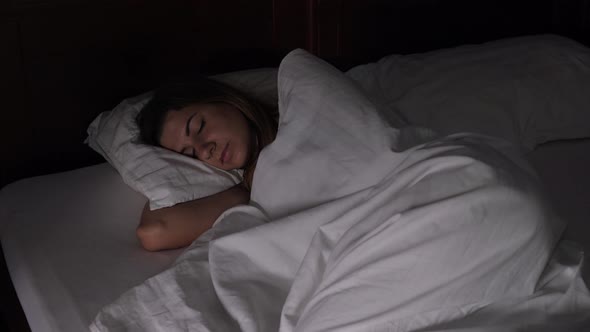 Woman Sleeps In Bed In The Dark Quickly Dawning, The Light Interferes With Sleep