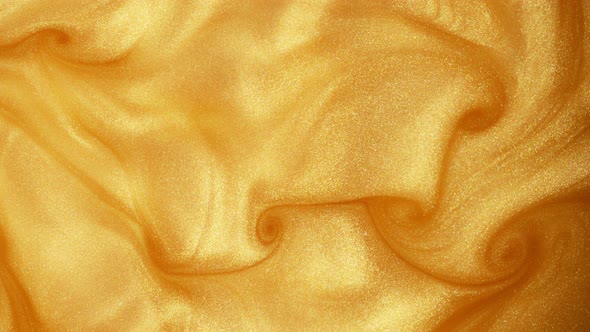 Super Slow Motion Shot of Golden Glittering Liquid Background at 1000Fps