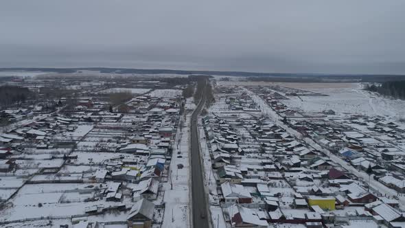 Aerial view of road in winter village