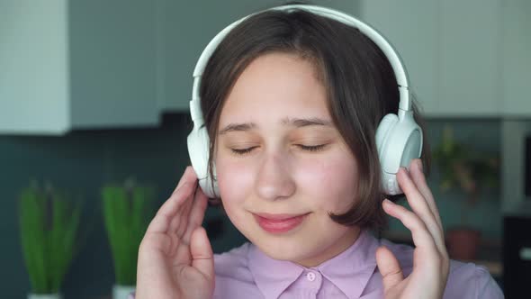 Extreme Close Up Slow Motion Young Stylish Short Hair Brunette Teen Headphones Enjoying Music