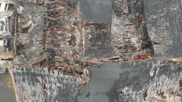 Ruins of Burned Industrial Building Birds Eye Close Up Aerial Descending