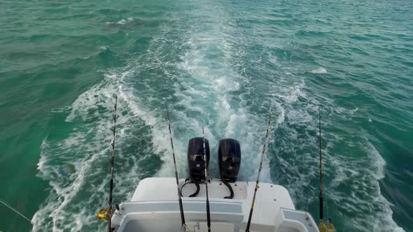 Motor Boat with Fishing Tackles Sailing in the Ocean