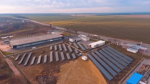 Solar panels in aerial view. Aerial view over solar panel farm outside