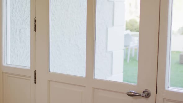 Delivery man wearing face mask with groceries knocking at the door