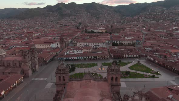 4k daytime aerial drone footage over the main Cathedral from Plaza de Armas in Cusco, Peru during Co