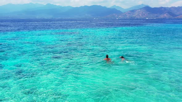 Beautiful fun women on vacation spending quality time at the beach on paradise white sand and blue 4