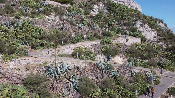 Drone View of a Steep Path Along Mount Lycabettus with Tourists in Athens