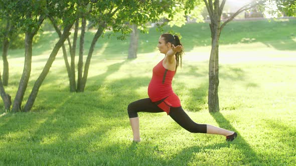 Pregnant Woman Stretching on Nature