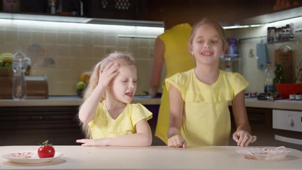 Young Children Have Fun in the Kitchen When Mom Is Cooking, Happy Emotions of Children Fooling