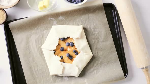 Step by step. Making peach galette with fresh local peaches.