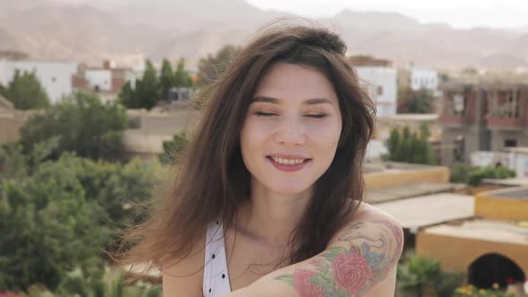 Close Up Portrait of Attractive Woman Smiling Brunette