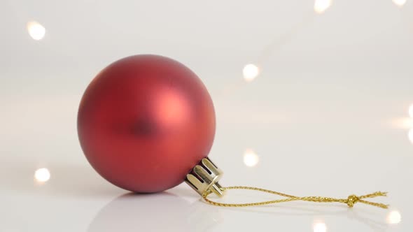 Slow tilt on matte red bauble with golden color string  4K 2160p 30fps UltraHD  footage - Round Chri