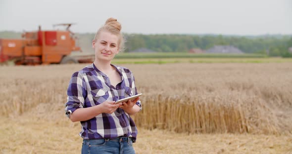 Agriculture Female Farmer Walking in Wheat Field with Digital Tablet