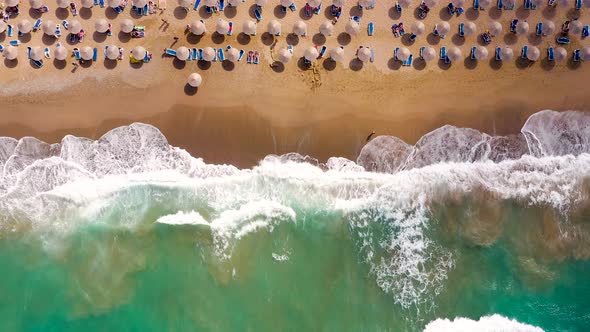 Aerial View of the Sea Sandy Beach Sun Umbrellas and Sunbeds Unrecognizable People