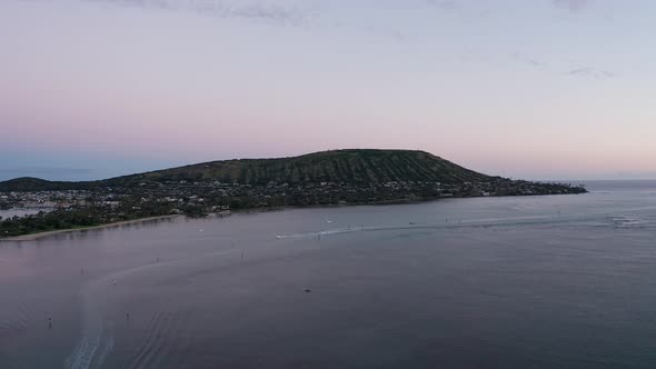 Wide aerial shot of a volcanic cone formation along the coast in O'ahu. Hawaii. 4K