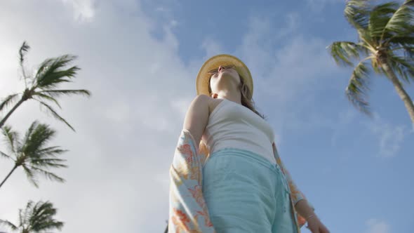 Slow Motion Sexy Woman in Colorful Beach Dress Spinning at Green Palms on Island