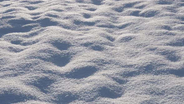 Frozen hill dunes of crystalline water tilting 4K 2160p 30fps UltraHD footage - White crystals of fi