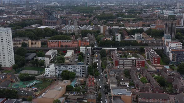 Forwards Fly Above Urban Neighbourhood with Rail Track