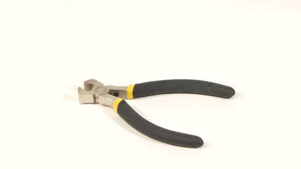 Wire Cutters with Yellow, Gray Handle on White, Rotation