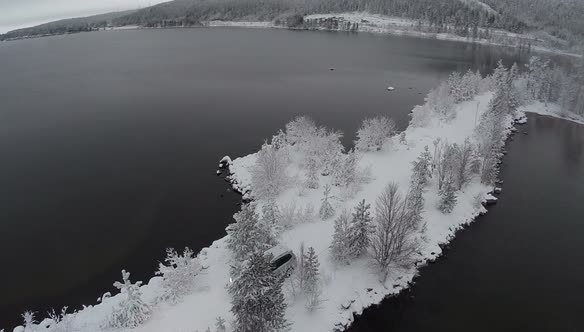 Car on the Dike through the Lake, Drone Shot