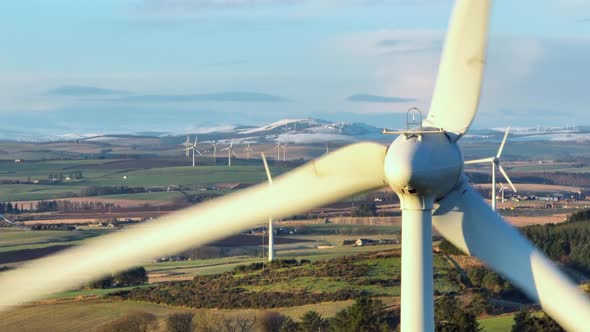 Wind Turbine at Sunset Generating Renewable Energy alt