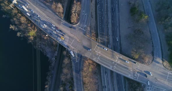 Top Down View of a Highway Junction and Train Tracks by River