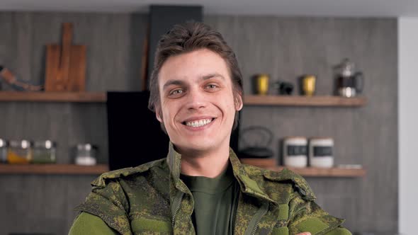 Portrait of a Young Soldier in Army Clothes