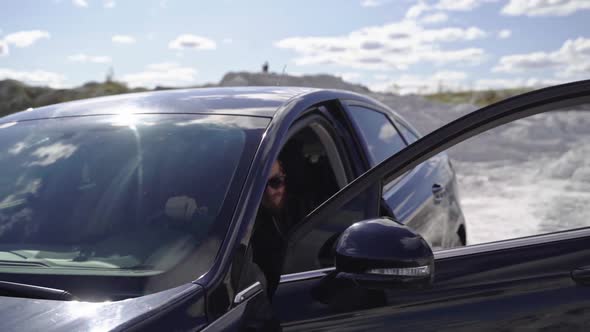 Bearded man in luxury car