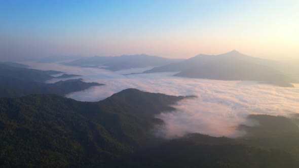 Flying over the clouds during morning sunrise. wonderful morning sunrise natural Landscape.