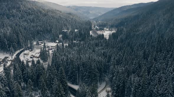 Aerial View of Snowed Winter Road in Carpathian Mountains Ukraine Bukovel