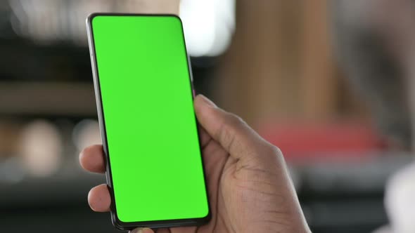 African Man Using Green Chroma Key Smartphone Screen 