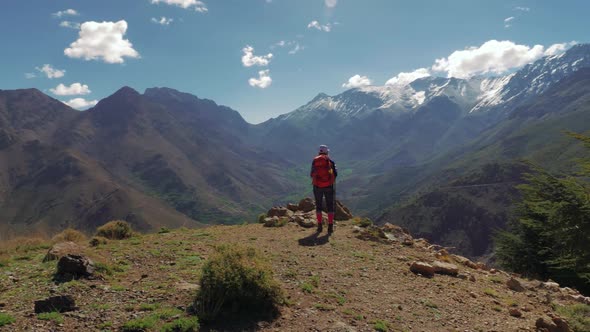 Backpacker girl in High Atlas mountains, Morocco, circular pan