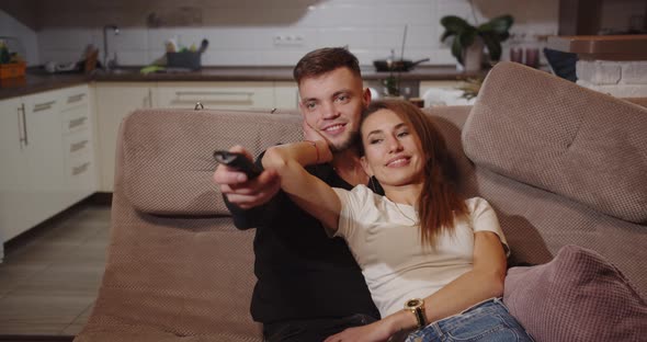 Couple In Love Happily Spending Time Watching Tv