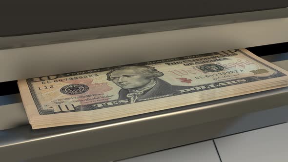 10 US dollar in cash dispenser. Withdrawal of cash from an ATM.