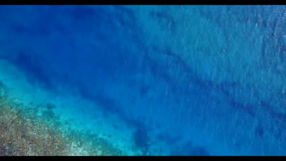 Aerial drone shot panorama of marine shore beach vacation by transparent sea and white sand backgrou