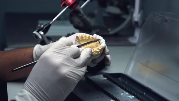 dental technician creates dental prostheses. laboratory. close-up.