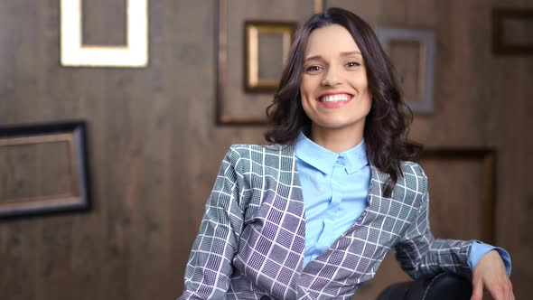 Medium Shot Happy Successful Businesswoman Smiling and Posing at Modern Office